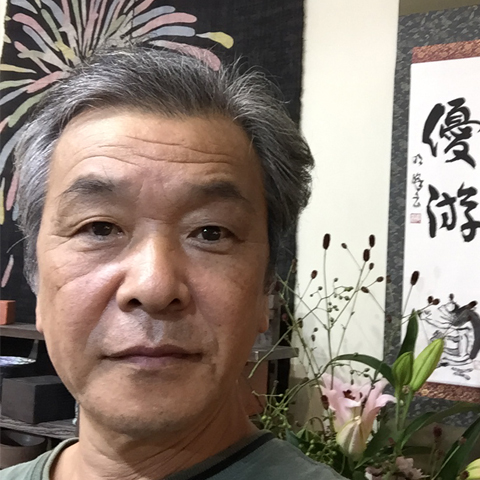 谷信男